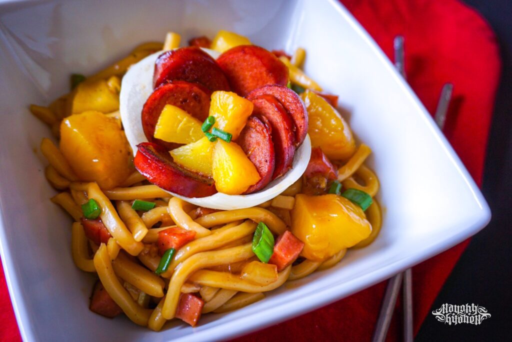 Hawaiian Kielbasa Stir Fry Udon Noodles in a white bowl