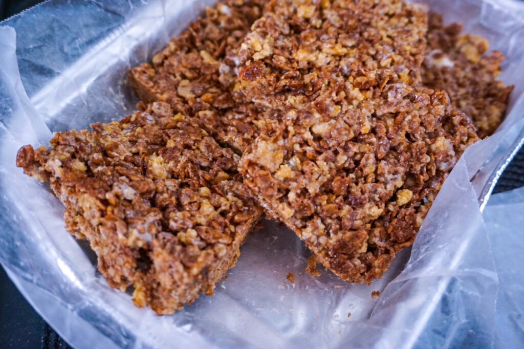 Cinnamon Chocolate Smores Krispies cut in a container