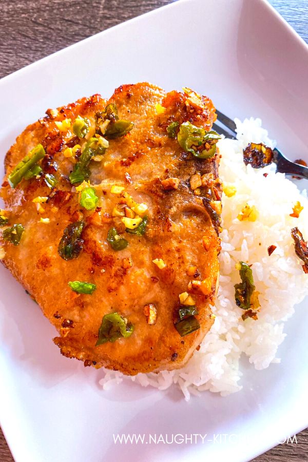 Salt & Pepper Pork Chops in a white dish