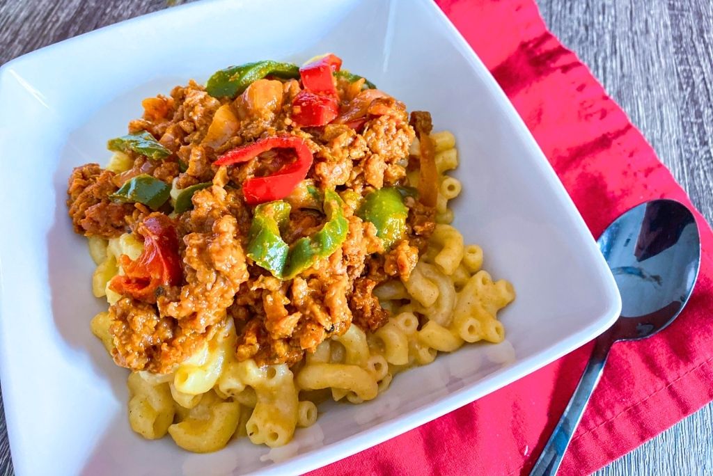 Fajita Mac and Cheese in a white bowl with spoon