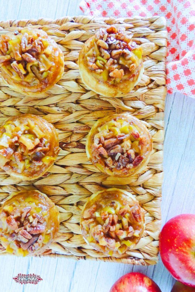 Upside Down Caramel Apple Biscuits on a wooden place mat.