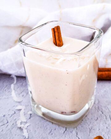 Coquito in a shot glass.