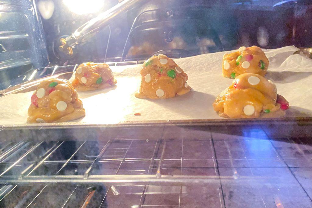 M&M Christmas Cookies baking in the oven.