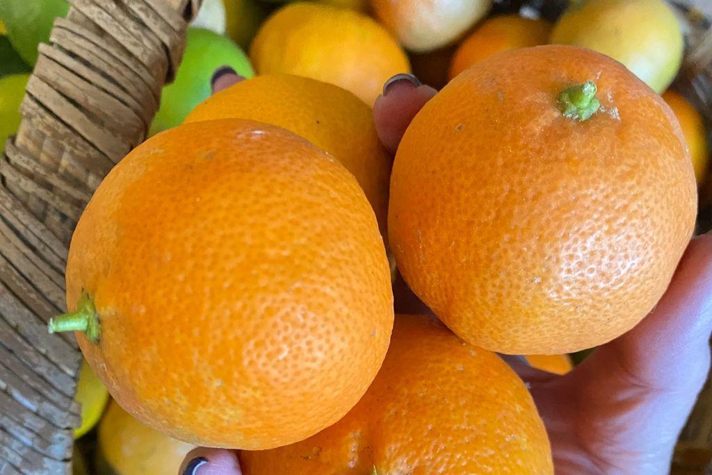 orange calamansi in a basket.