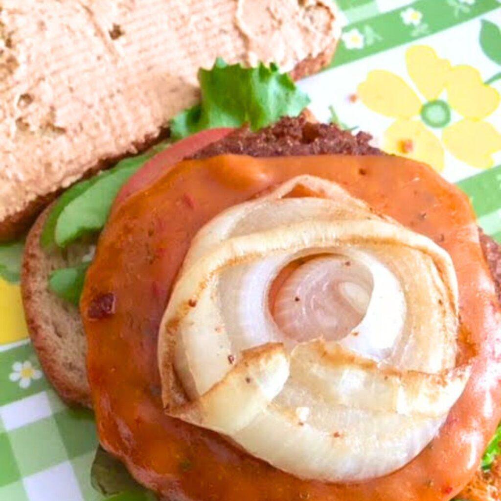 Vegan Patty Melt with Bitchin Sauce and Plant Based Cheese with Grilled onions.