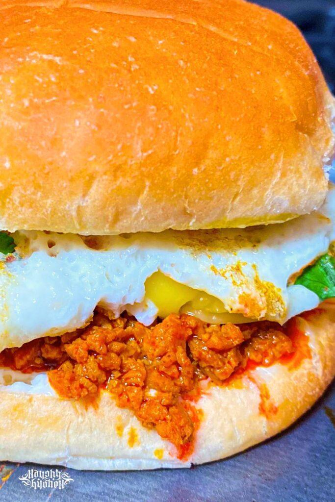 Chorizo cilantro egg melt half close up.