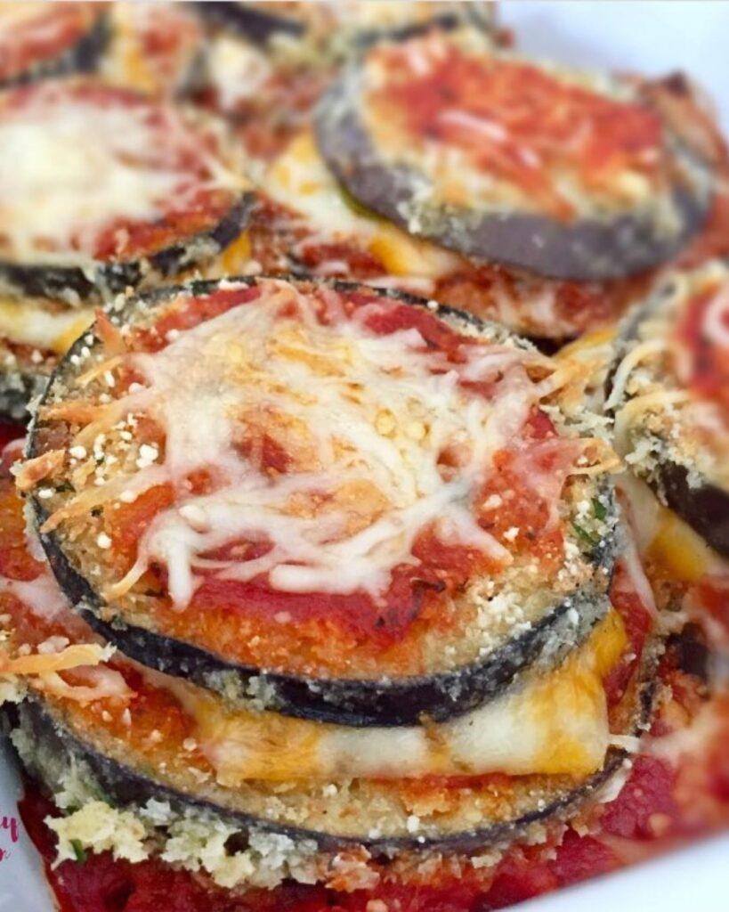 Crispy eggplant parmesan with cheese on top.