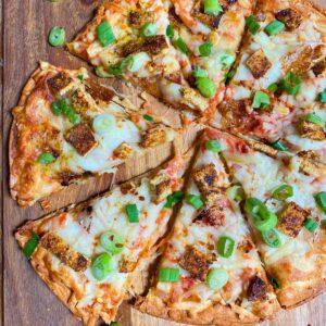 Tofu Curry Pizza on a carving board.