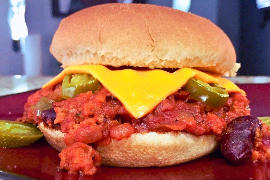 Vegetarian Sloppy Joes Sandwich on a red plate.