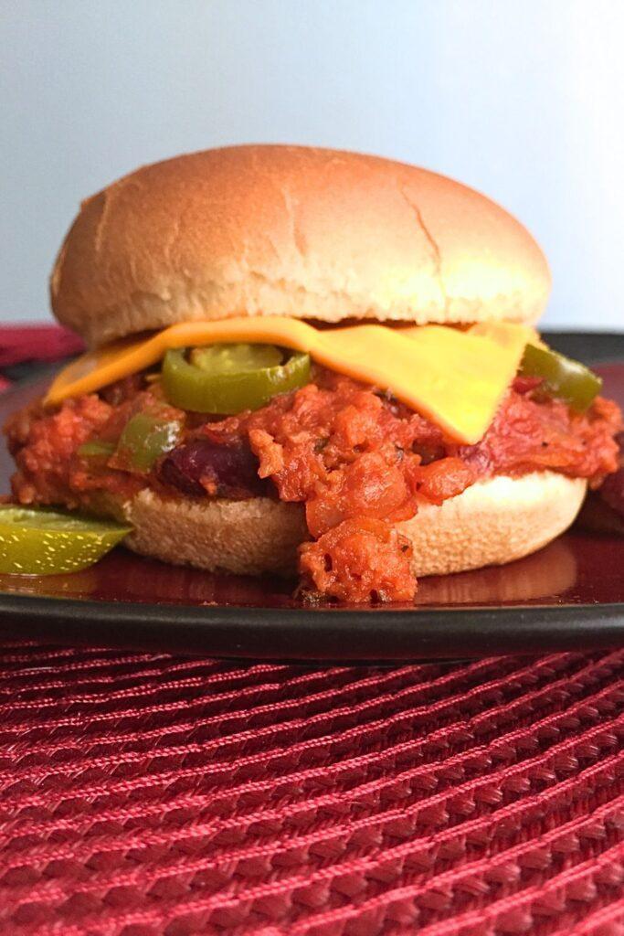 Vegetarian Sloppy Joes sandwich with white background.