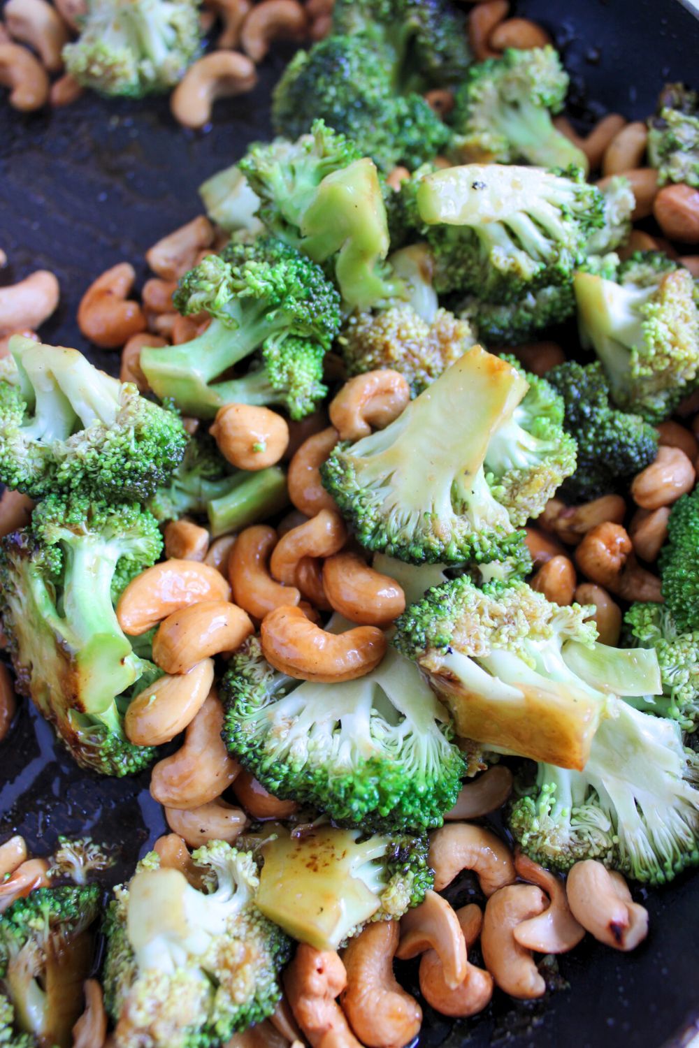 broccoli and cashews in a pan.