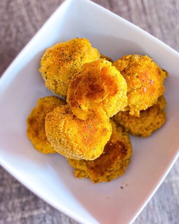 Mac and cheese bites in a white bowl.